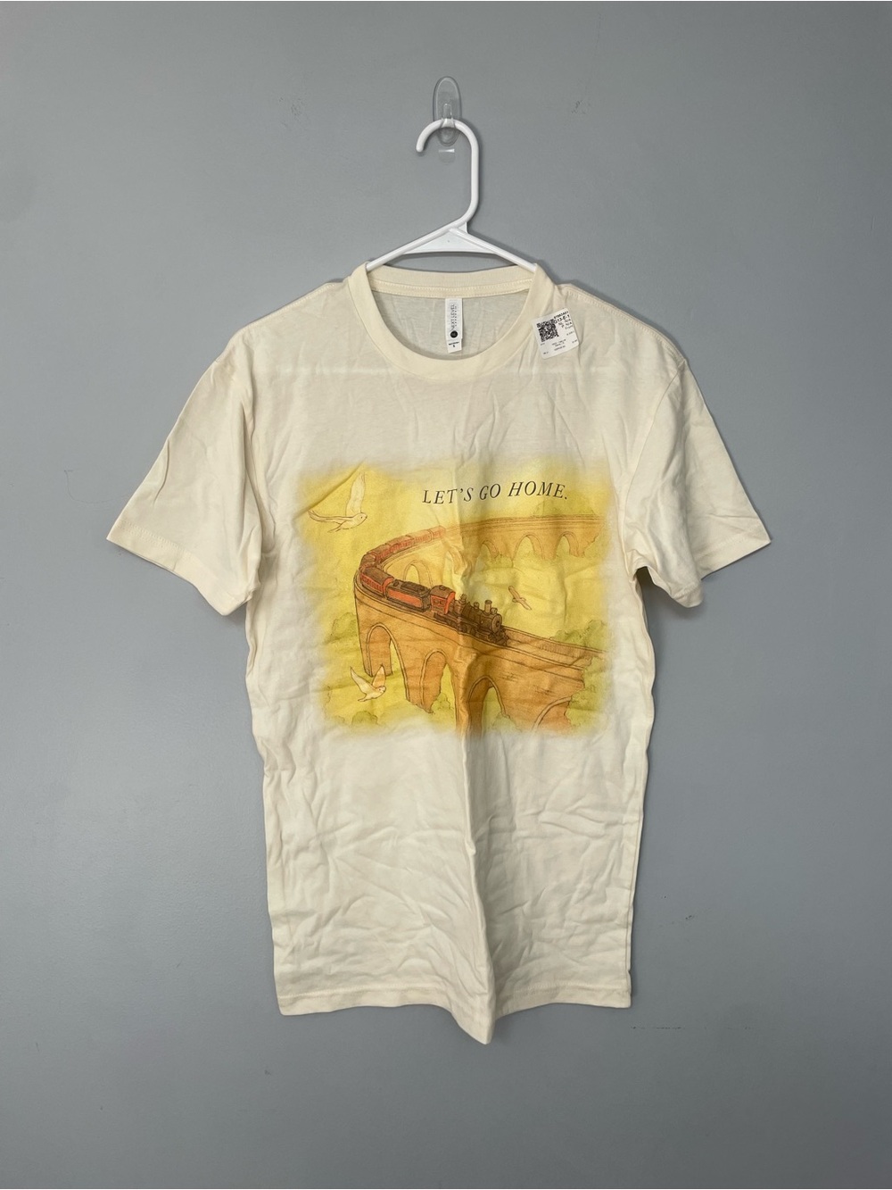 Next Level Apparel Cream Graphic 'LET'S GO HOME.' Train Tee